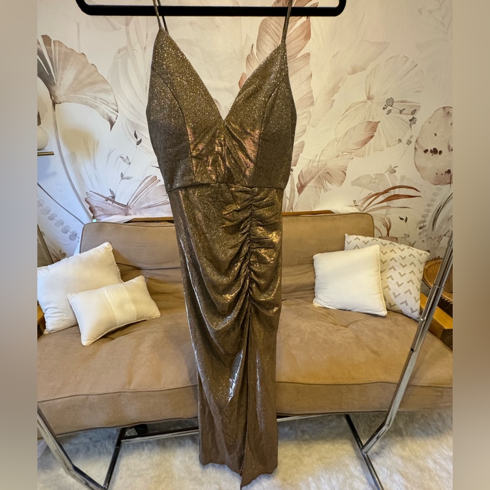 Gold gown by Emerald Subdae